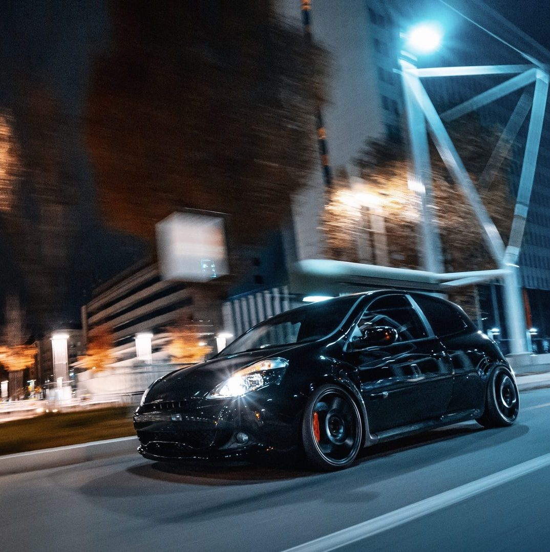 black sedan on road during night time